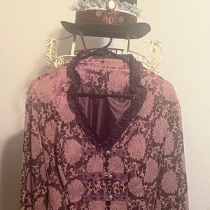 Victorian jacket w/long tail. Fun piece to have in your collection.